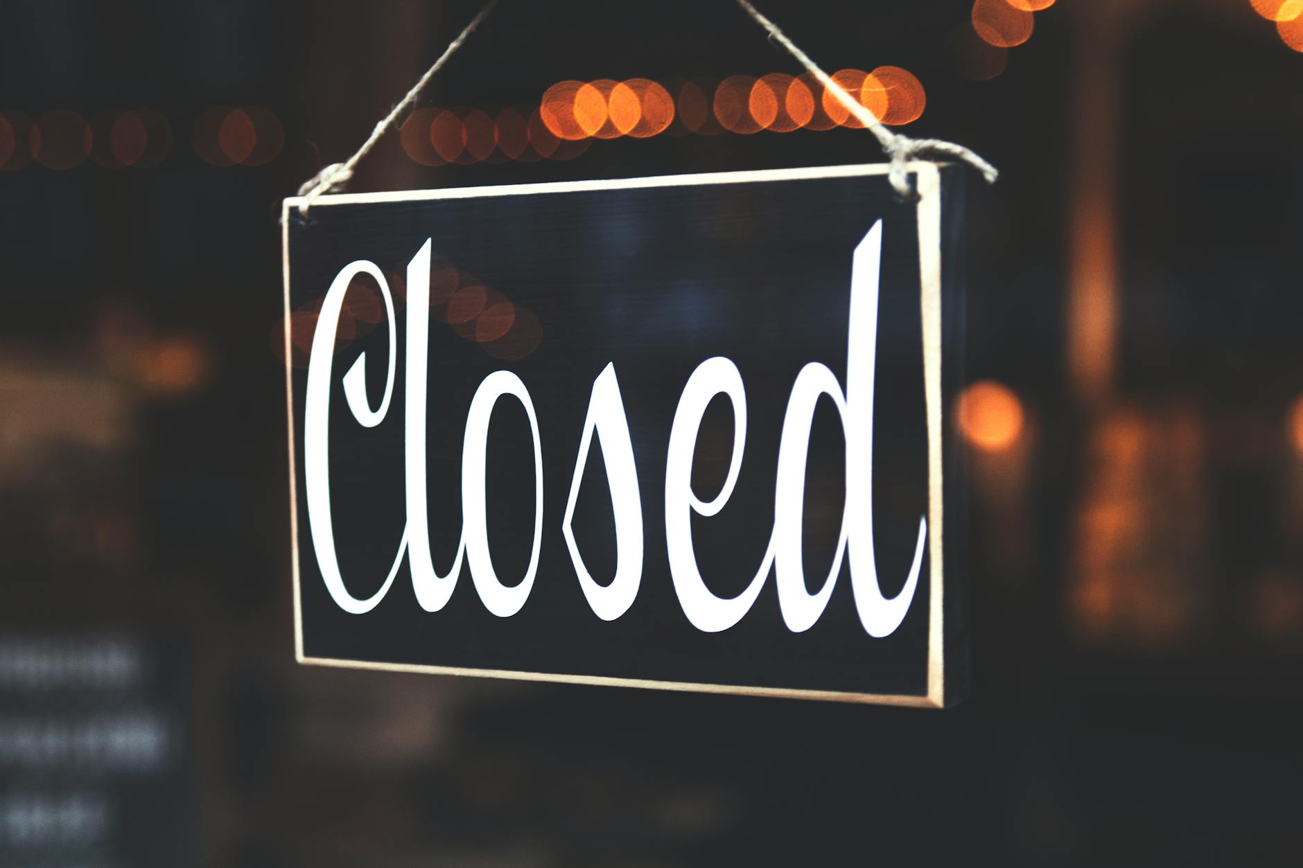 selective focus photography of closed signage