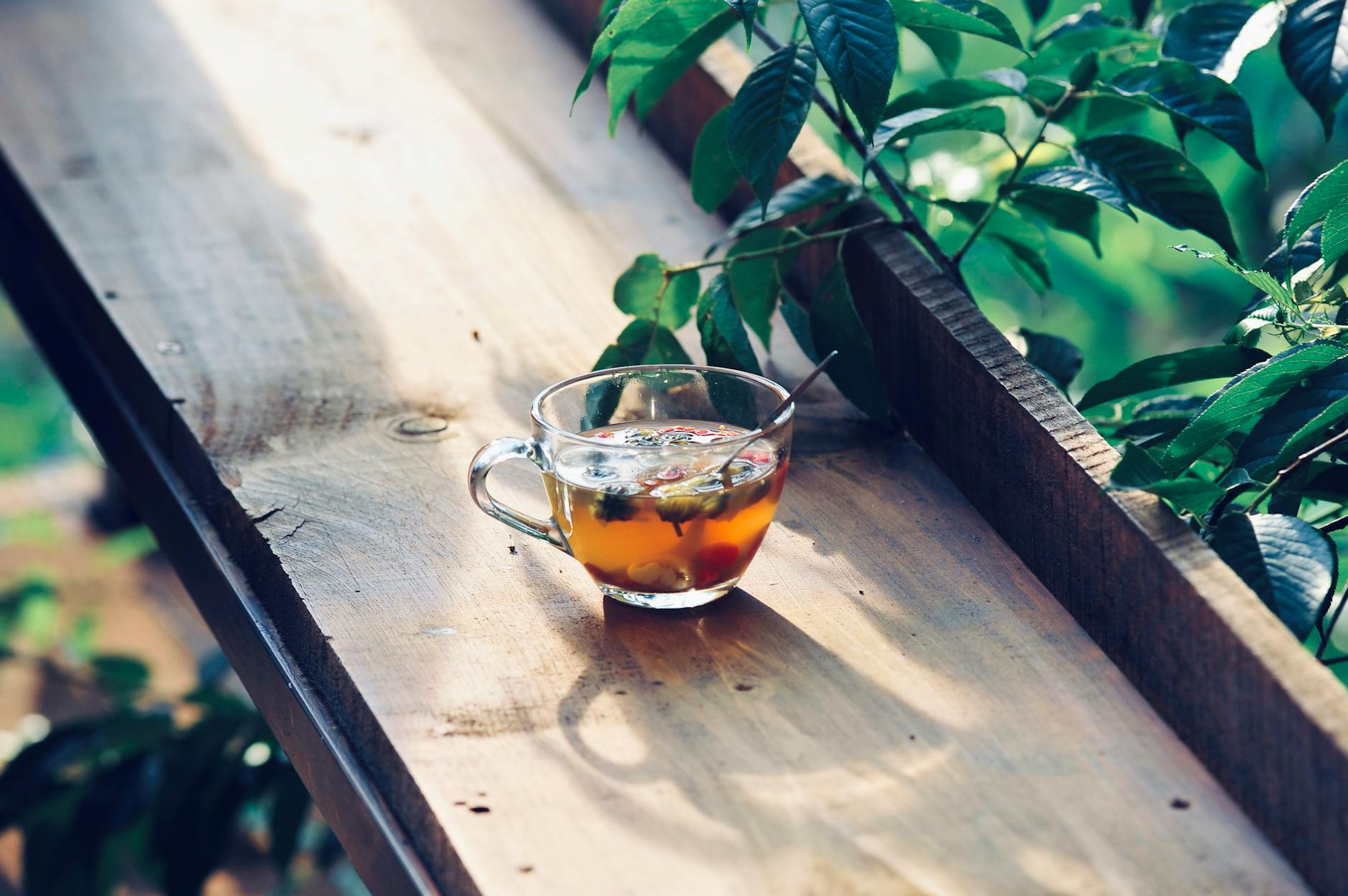 refreshing herbal tea on wooden outdoor table